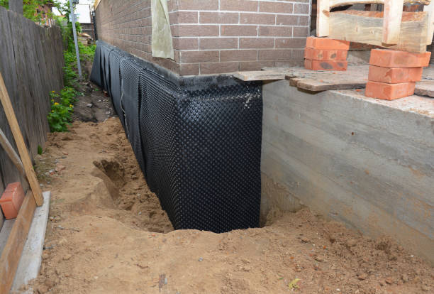 Happy homeowners after waterproofing job in Orland